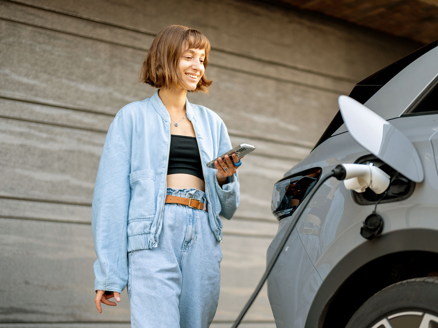 Young Woman Charging Ev Alex